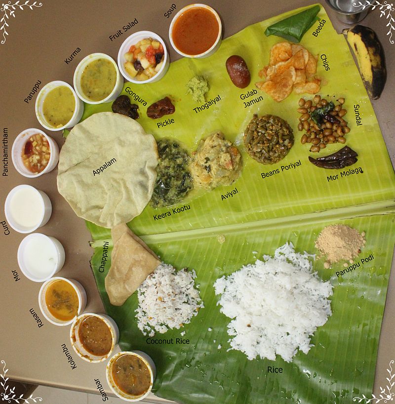 Complete Tamil Nadu food served on a banana leaf केले के पत्ते पर परोसा हुआ तमिलनाडु का सम्पूर्ण भोजन